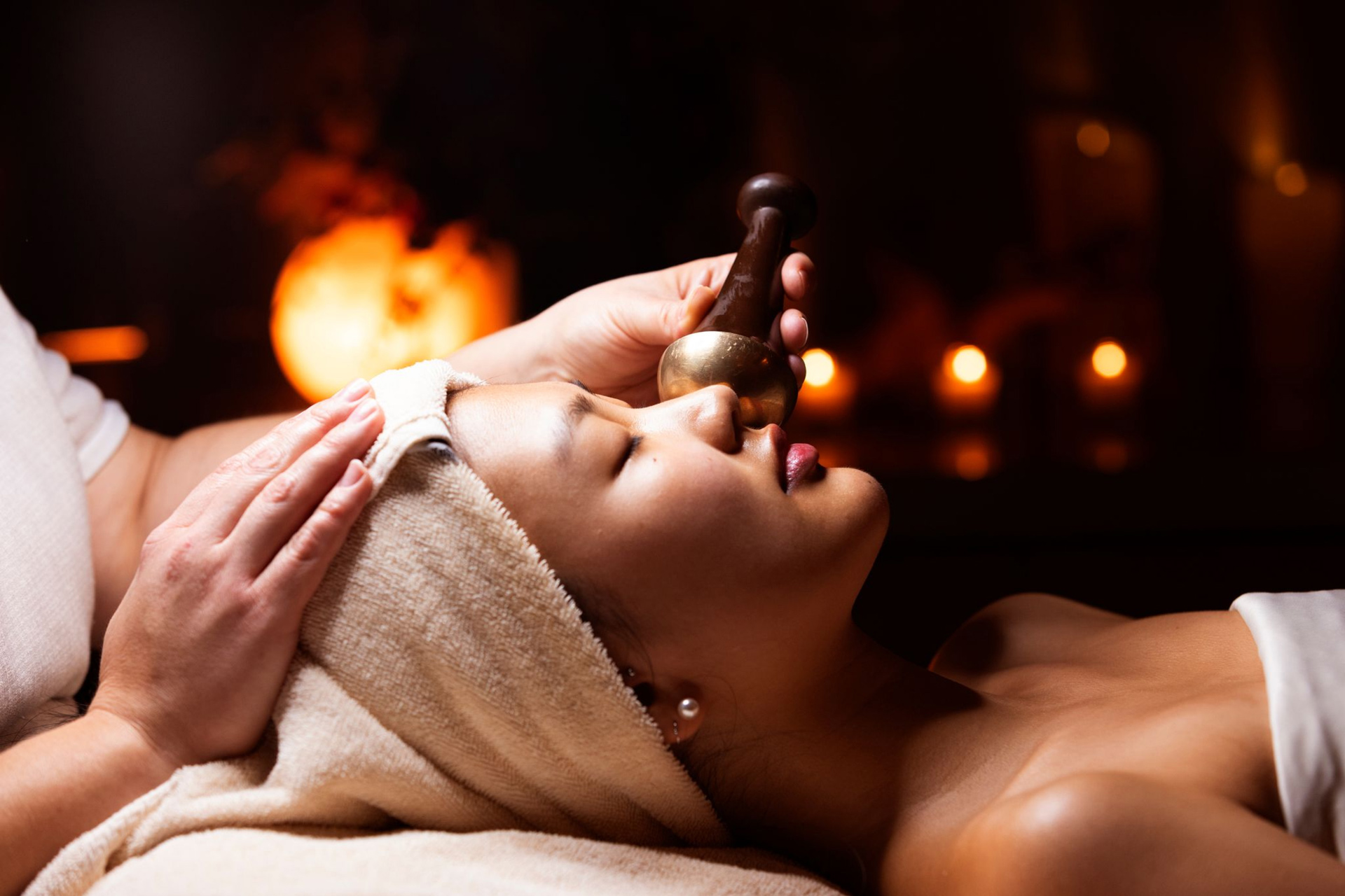 Open gallery overlay: woman laying down on a spa table getting a facial
